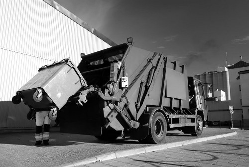 Professional clearance team sorting office items